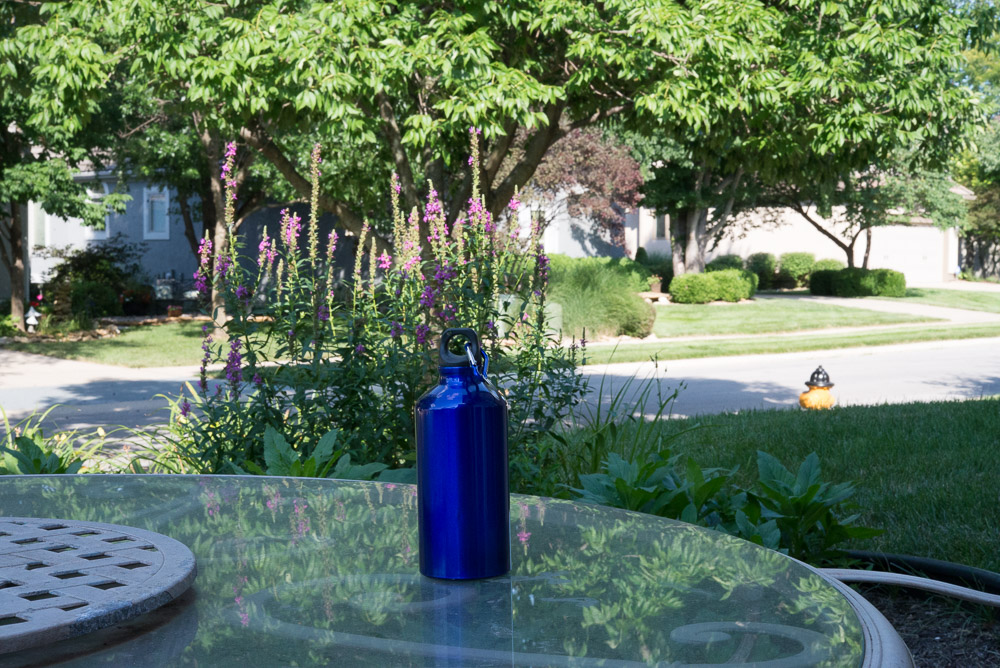 Photo of a blue water bottle shot with a large depth of field showing most everything in focus