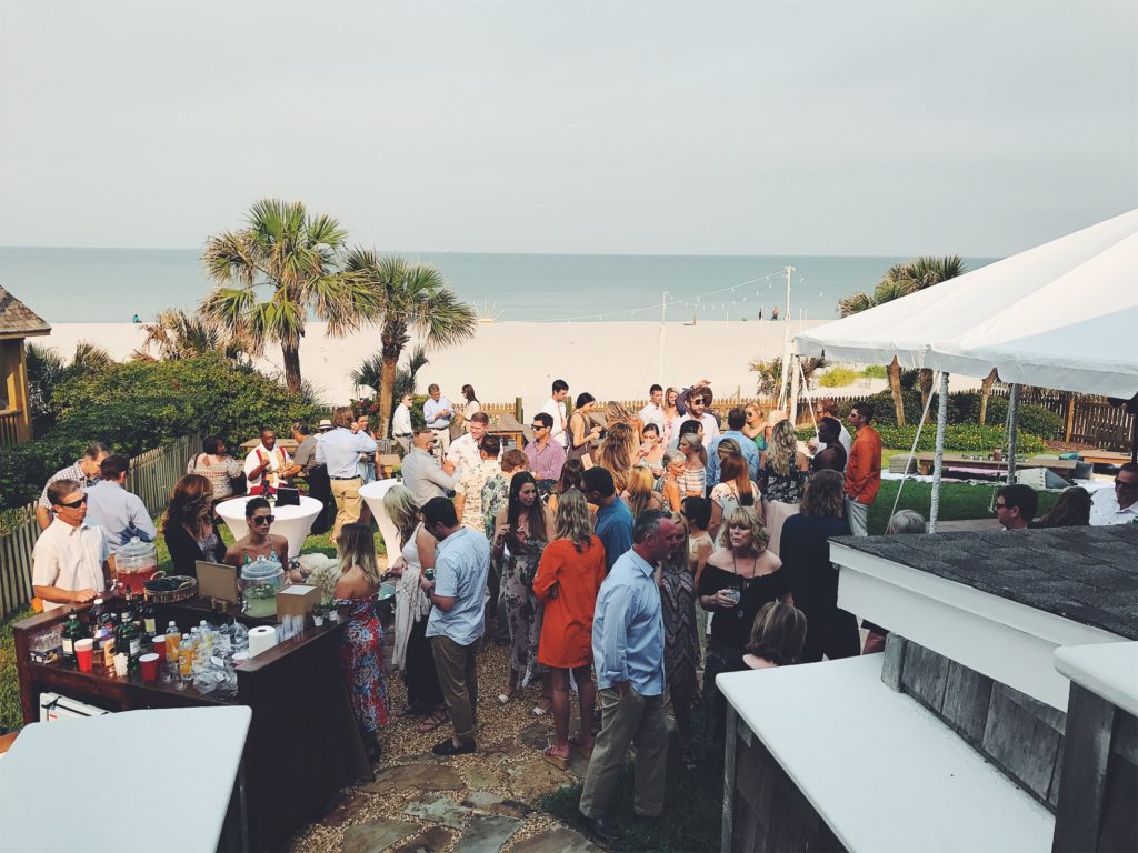 iPhone 7 Plus image of people gathered for a wedding on a beach