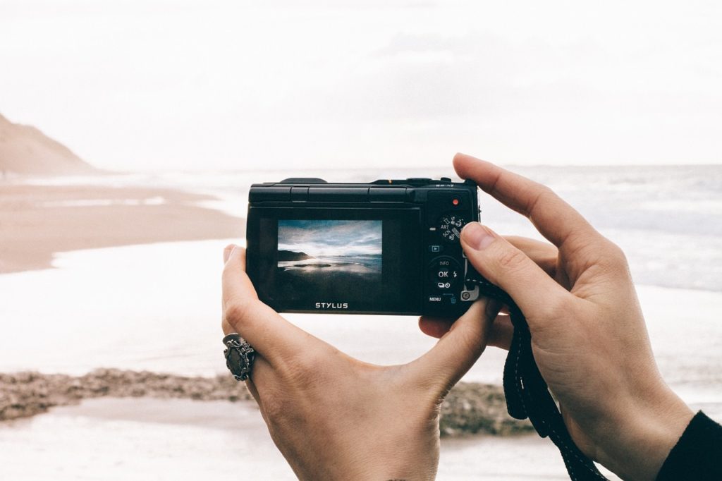 Image showing a photographer using their camera from the LCD screen