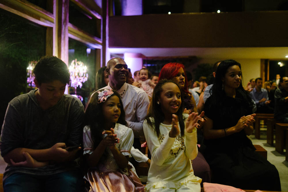 Image of wedding guests applauding during the ceremony