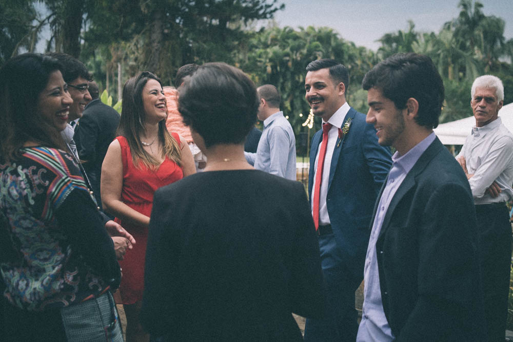 Image of a groom laughing and socializing before his wedding ceremony