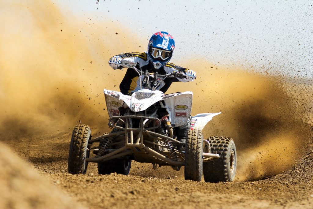 image of a person racing on a four wheeler showing the speed of DSLR cameras and their lenses