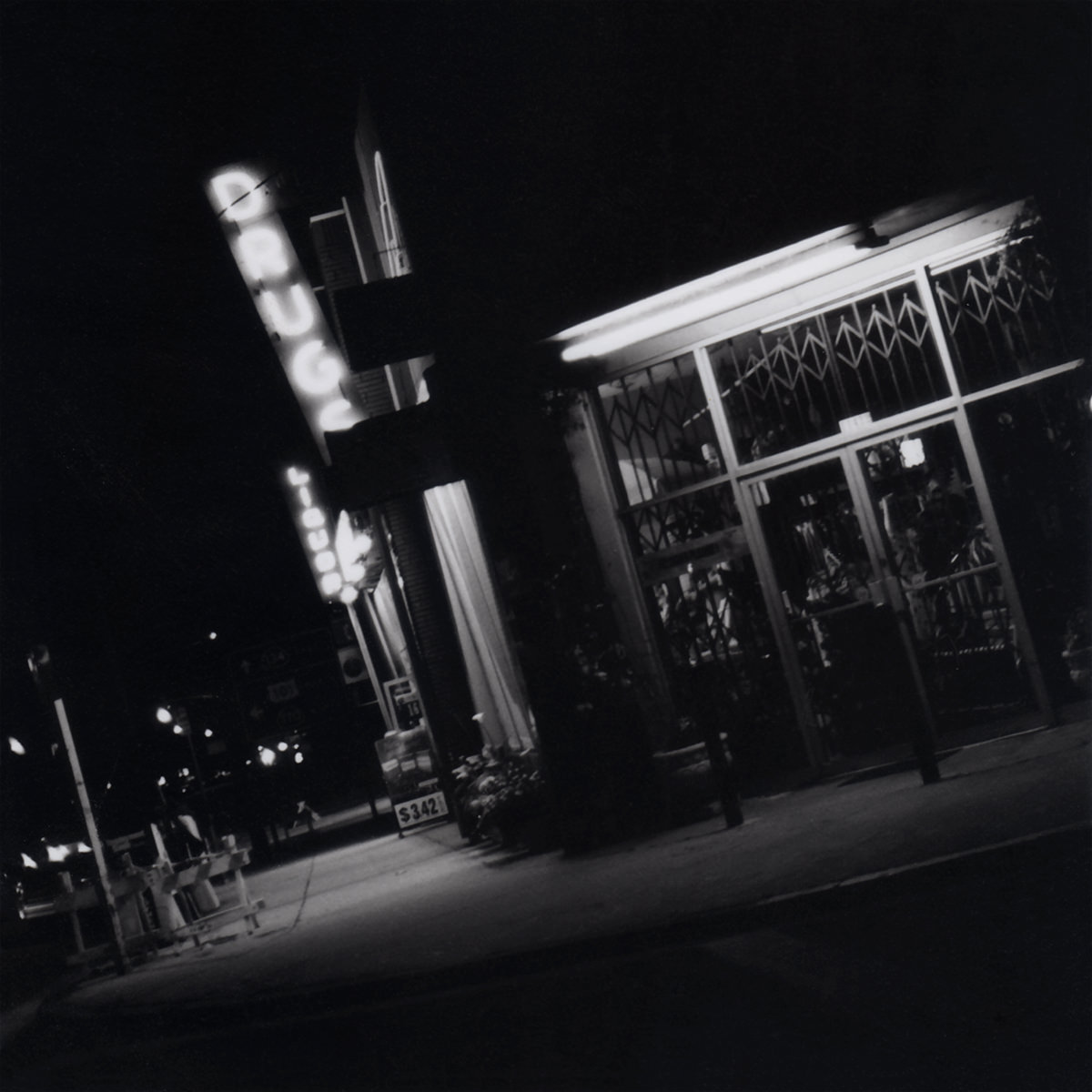 A drugstore at night in black and white.