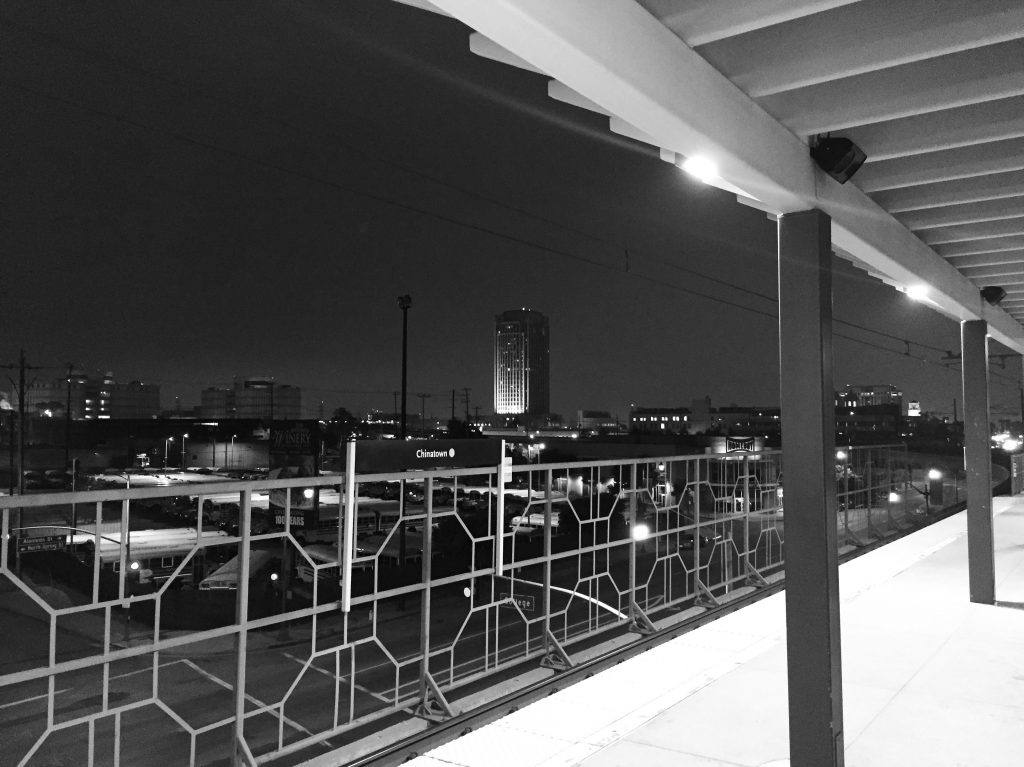 An image of a cityscape looking over a railing to answer 'what is cityscape photography?'