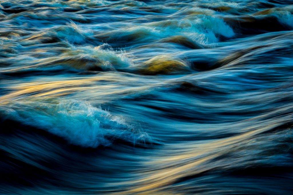 Image of soft waves in water as an example of creative abstract nature photography