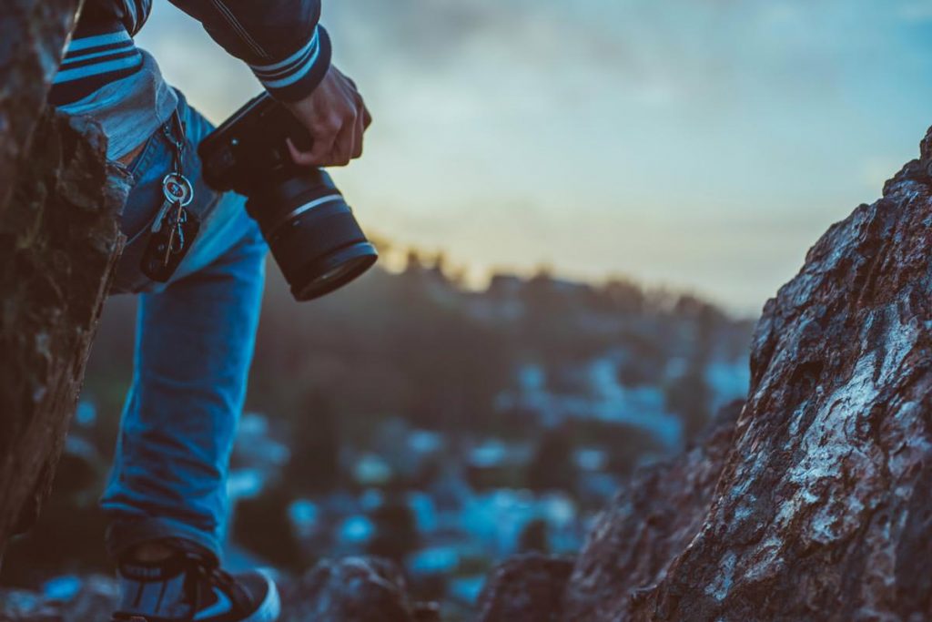 Image of a nature photographer looking for the next shot