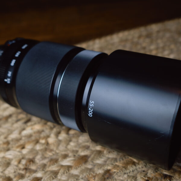Image of the Fujifilm XF 55-200mm f/3.5-4.8 R LM OIS from a diagonal angle.
