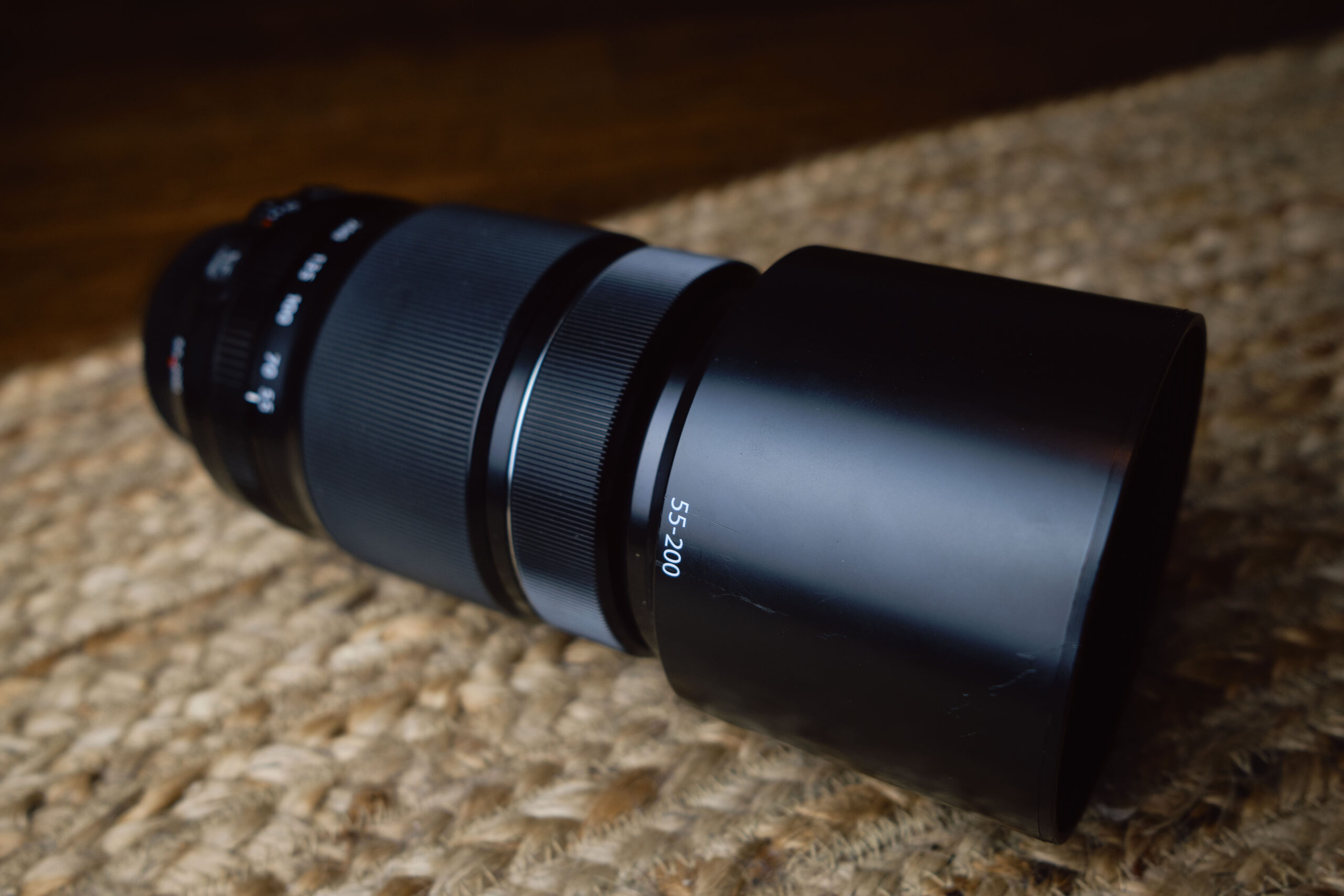 Image of the Fujifilm XF 55-200mm f/3.5-4.8 R LM OIS from a diagonal angle.