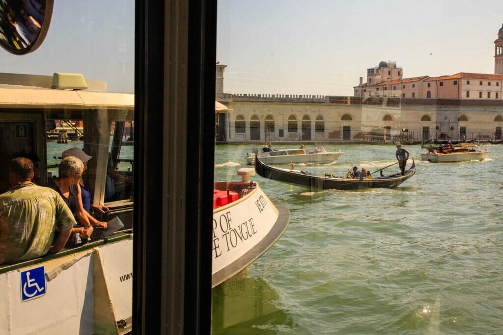 Boats on water in Venice, Italy on a sunny day.