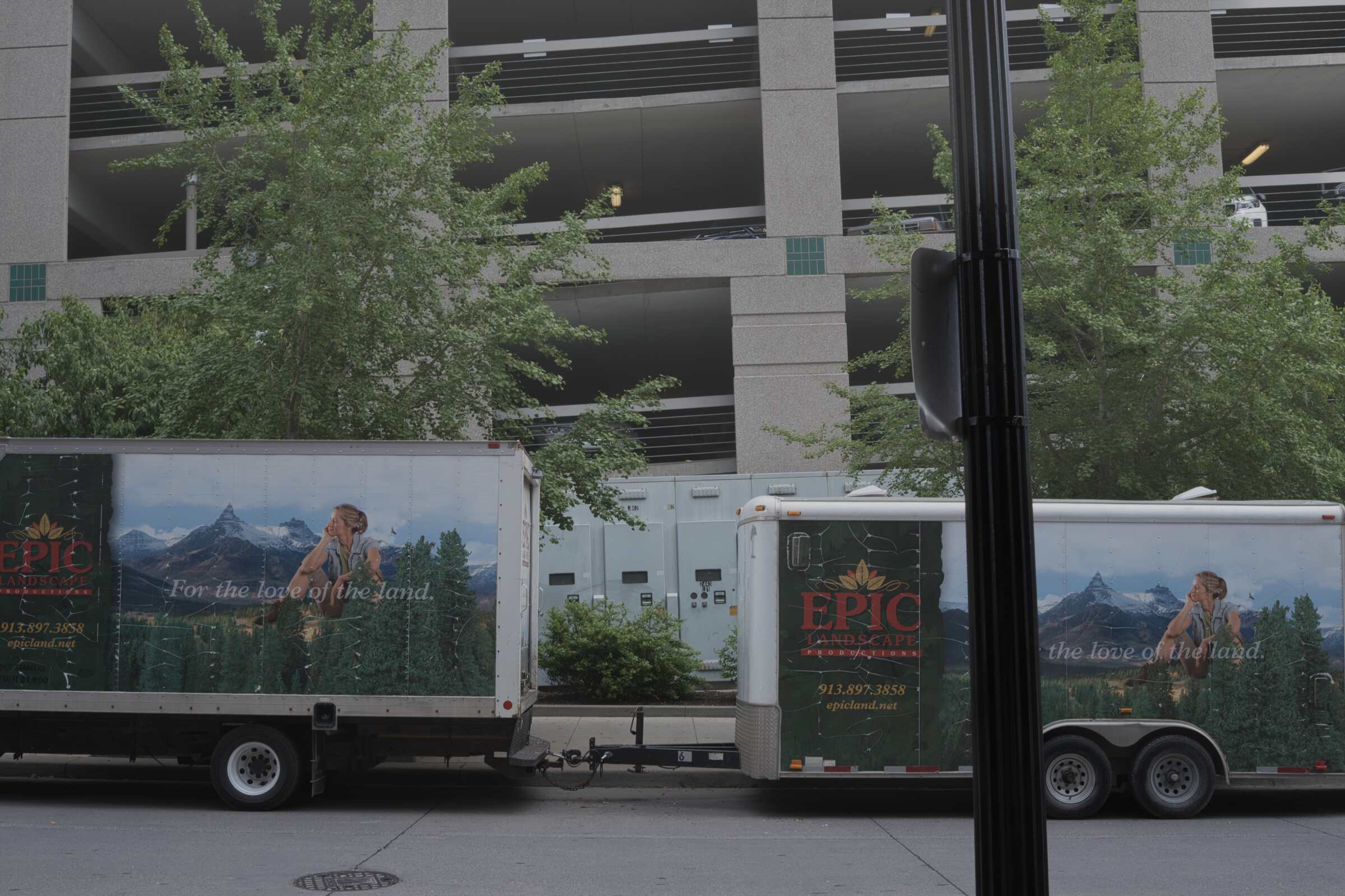 Photo of two trucks on a city street with fog effect added.