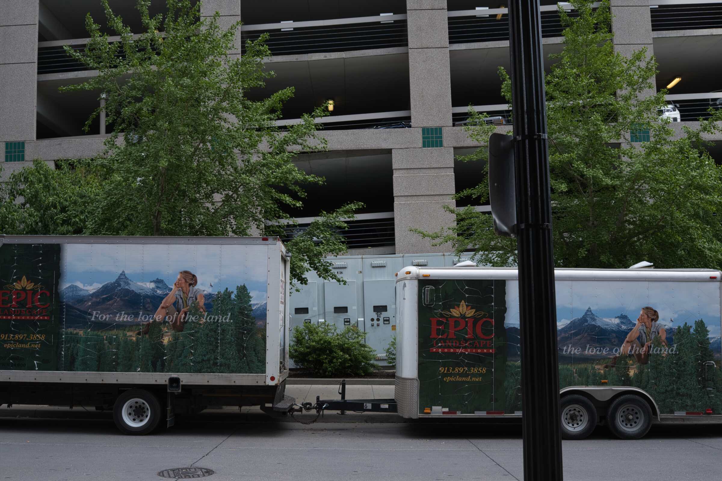 Photo of two trucks on a city street unedited.