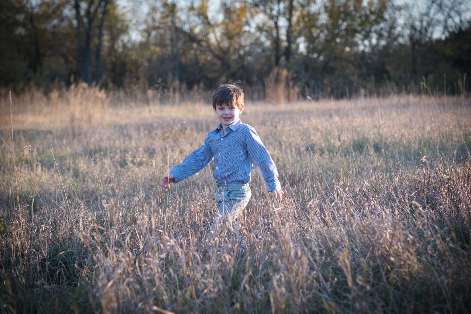 Boy in a field with vignette added.