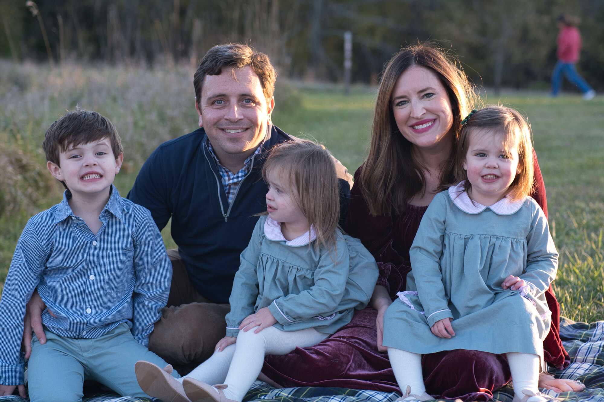 Family portrait with a distracting element in the background.