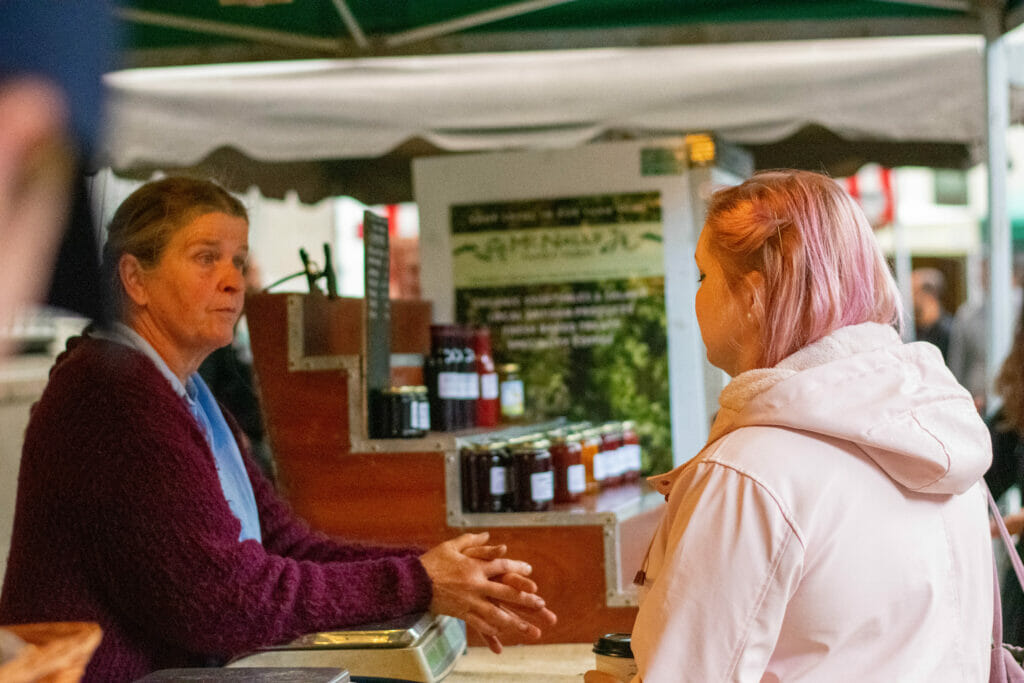 Two women talking in a business.