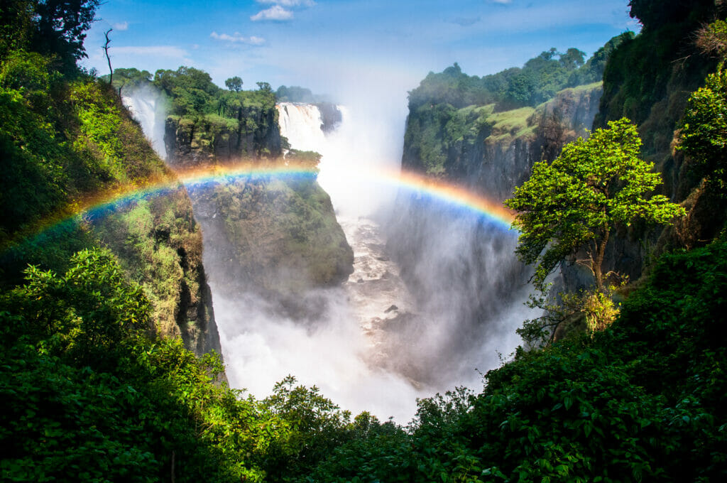 A waterfall with a rainbow.