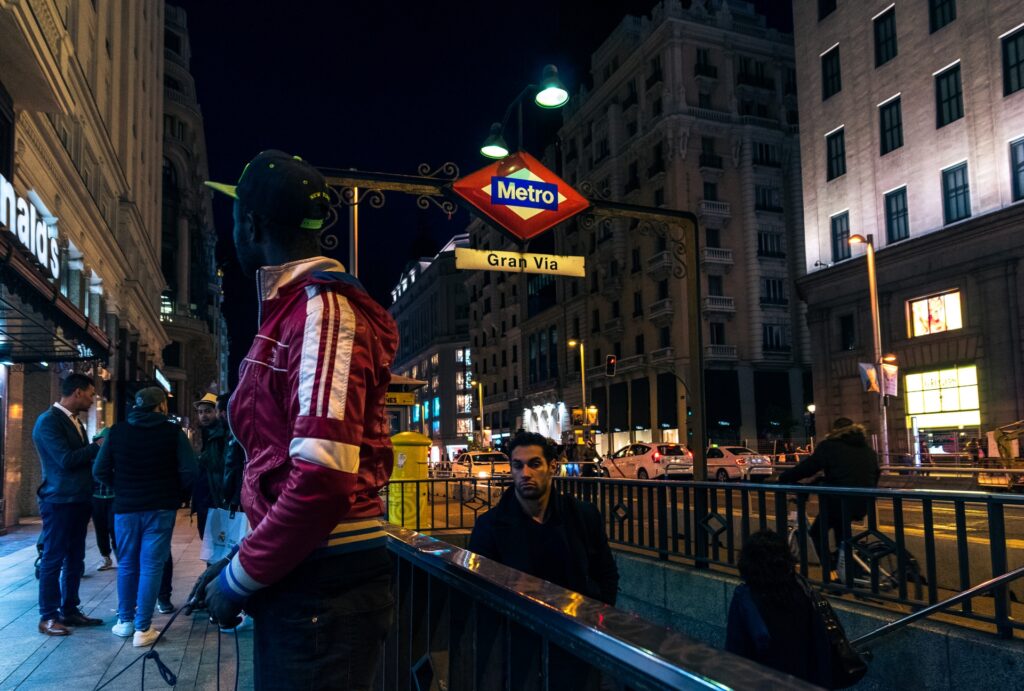 A subway entrance with people milling around.