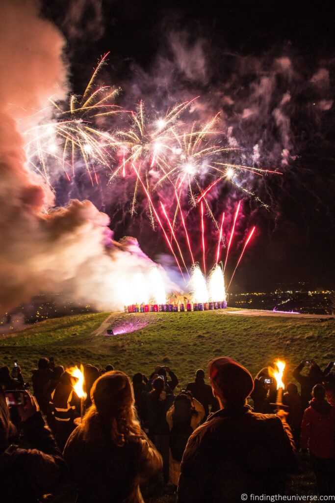 A crowd watching a fireworks display.