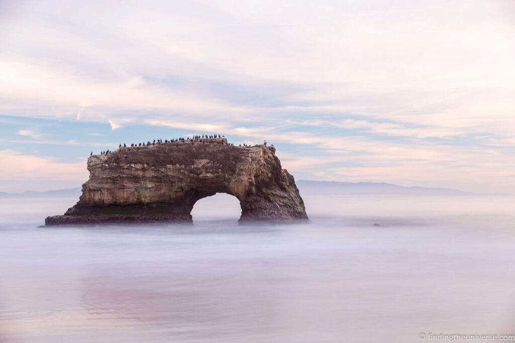 A rock formation on a beach.